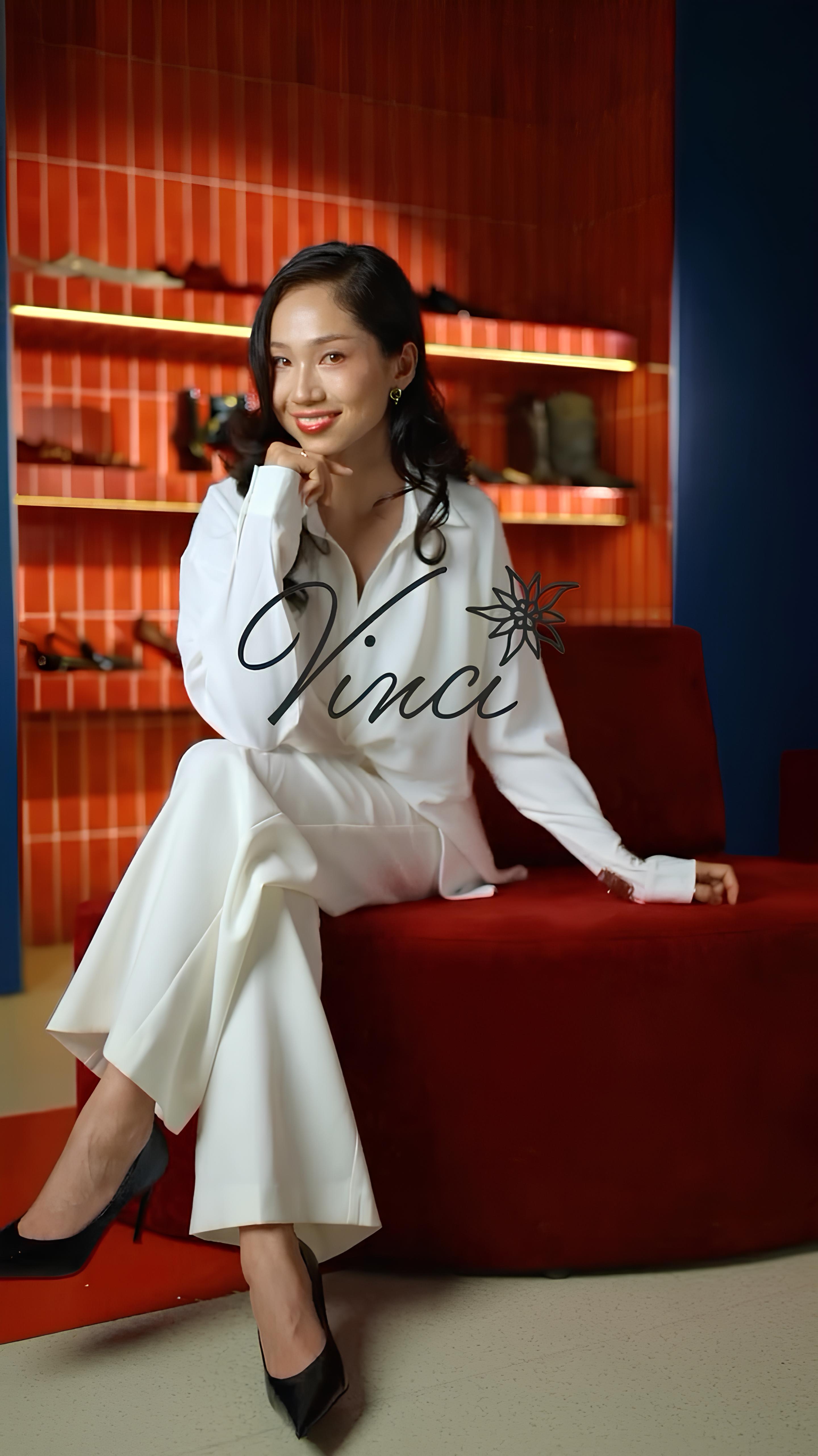 Vinci customer seated in the store wearing black pumps